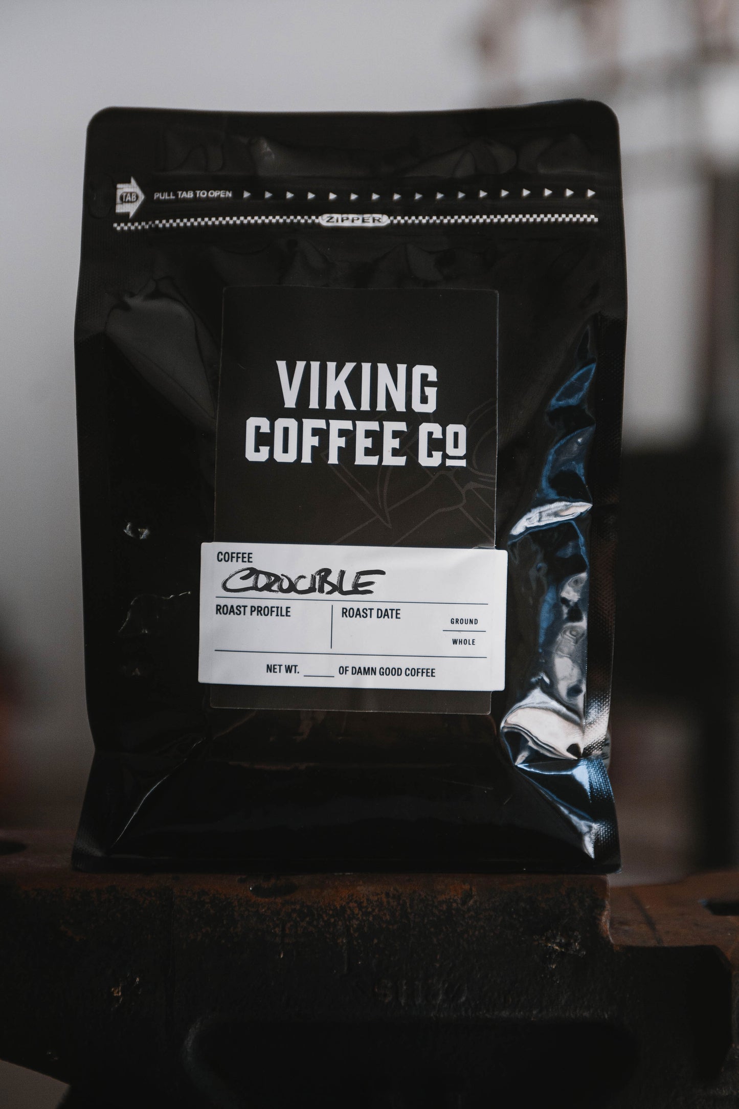 Crucible blend dark roast coffee in black Viking Coffee packaging