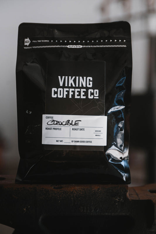 Crucible blend dark roast coffee in black Viking Coffee packaging